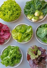 Obraz premium Fresh Assortment of Colorful Greens Displayed in Bowls for Healthy Meal Preparation in a Bright Kitchen