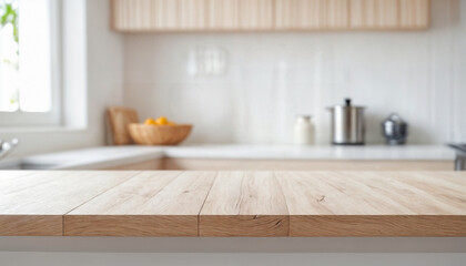 Empty wooden table with the bright white interior of the kitchen as a blurred background behind the bokeh golden sunshine