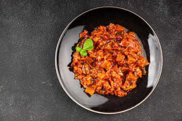 Eggplant stew dish vegetables salad tasty fresh delicious gourmet food background on table rustic food top view copy space keto and paleo diet vegetarian and vegan food