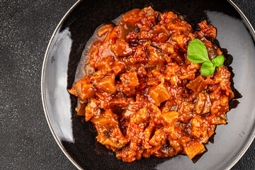 Eggplant stew dish vegetables salad tasty fresh delicious gourmet food background on table rustic food top view copy space keto and paleo diet vegetarian and vegan food