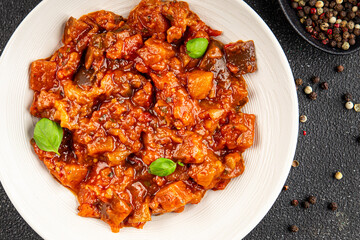 Eggplant stew dish vegetables salad tasty fresh delicious gourmet food background on table rustic food top view copy space keto and paleo diet vegetarian and vegan food