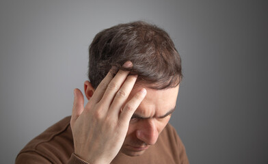 Caucasian man after eleven month hair transplantation.