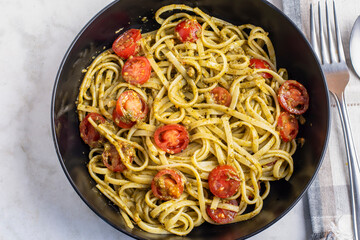 spaghetti with pesto and tomatoes
