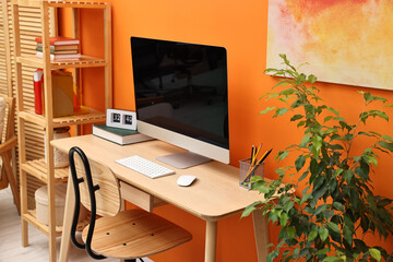 Comfortable workplace with modern computer on wooden table indoors