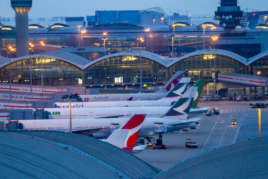 Chek Lap Kok, Hong Kong - June 15, 2016 : Commercial Airplanes Connected To Terminal Of Hong Kong International Airport.