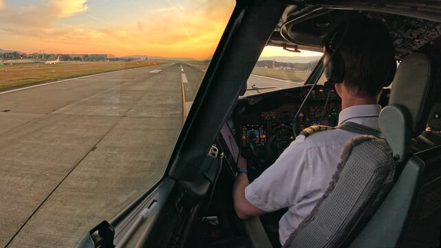 Stunning cockpit view of a passenger jet takeoff at sunset