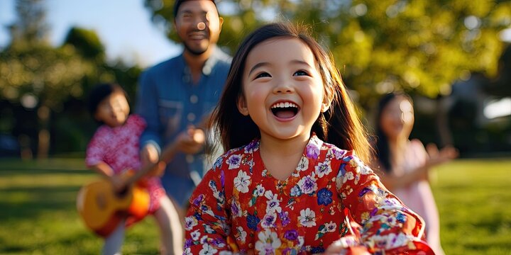  asian american family having fun in the park