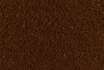 Detailed texture of natural decaffeinated ground coffee, seen up close