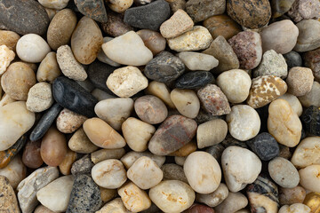 Textures of beach pebbles in various shapes and colors