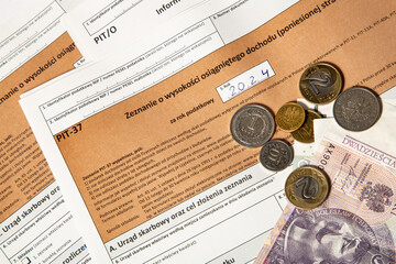 Close-up. Background. PIT-37. Polish tax return form for 2024 (called PIT) with money