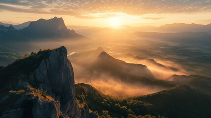 Fototapeta premium reathtaking Mountain Landscape at Sunrise with Mist and Golden Light