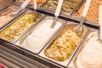 display case in a cafe with different types of gelato ice cream in Italy