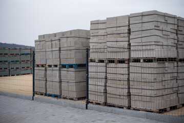 Hollow Concrete Wall Blocks Stacked on Pallets for Construction