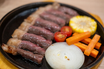 Grilled meat steak served on plate with various vegetable