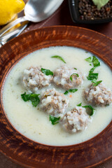 Traditional Greek Avgolemono Soup Close up.