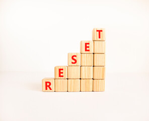 Reset symbol. Concept word Reset on beautiful wooden blocks. Beautiful white table white...