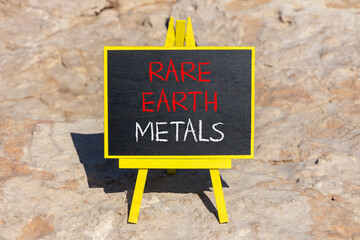 Rare earth metals symbol. Concept words Rare earth metals on beautiful blackboard. Beautiful brown...