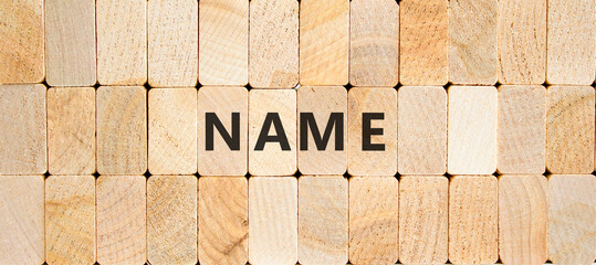 Name symbol. Concept word Name on beautiful wooden blocks. Beautiful wooden blocks background. Business, lifestyle, support and name concept. Copy space.