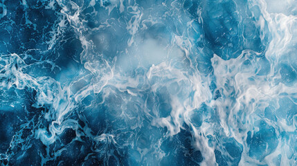 Obraz premium Aerial view of ocean waves creating dynamic blue and white pattern. vibrant colors evoke sense of tranquility and movement