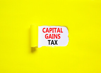 Capital gains tax symbol. Concept words Capital gains tax on beautiful white paper. Beautiful yellow paper background. Business and capital gains tax concept. Copy space.