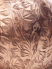 leaf pattern golden metallic shiny surface