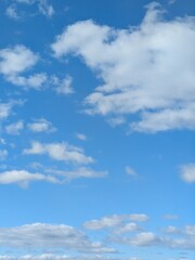 Obraz premium Beautiful Large White Clouds in a Calm Blue Sky