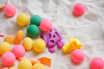 Colorful ball toys in children's sandbox
