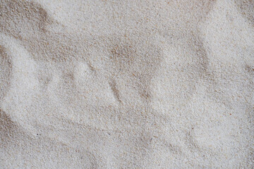 Top view of fine sandy beach surface in summer.