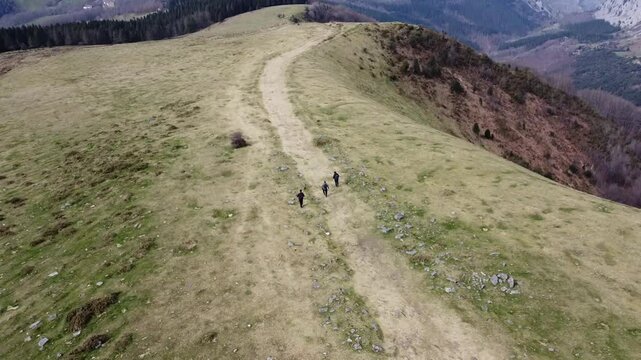 aerial view of hikers hiking in y&iexcl;the mountains of Urkiola Natural Park in the basque country