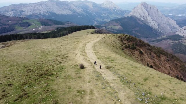 aerial view of hikers hiking in y&iexcl;the mountains of Urkiola Natural Park in the basque country