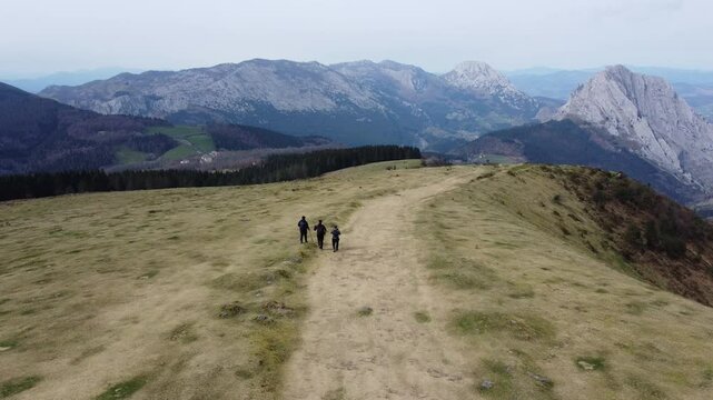 aerial view of hikers hiking in y&iexcl;the mountains of Urkiola Natural Park in the basque country