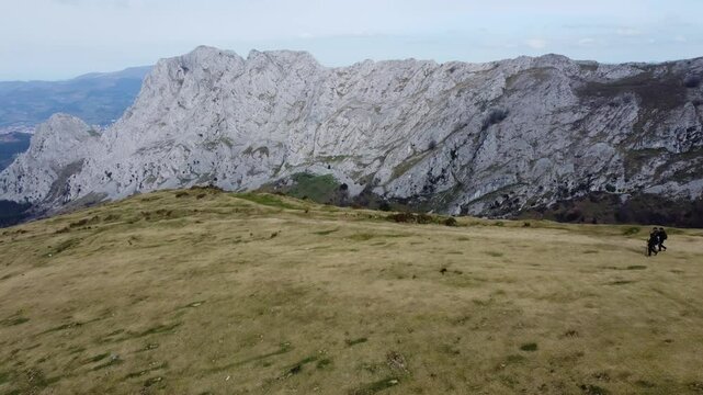 aerial view of hikers hiking in y&iexcl;the mountains of Urkiola Natural Park in the basque country
