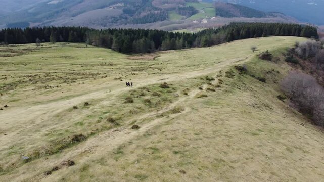 aerial view of hikers hiking in y&iexcl;the mountains of Urkiola Natural Park in the basque country