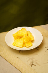 Cut pineapple on a simple background