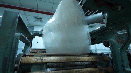 Carding machines in a woolen sweater factory
