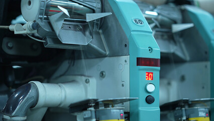 Cone winders in a woolen sweater factory