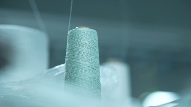 Spools of thread in a textile factory