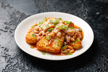 Loaded Hash Browns with baked beans and cheese