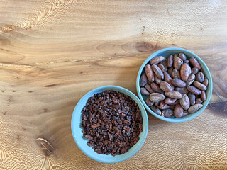 A green plate with cocoa beans and chocolate. For food, agriculture, or chocolate branding projects.
