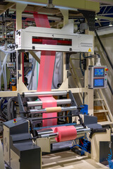 Plastic film extrusion. Industrial line for the extrusion production of polyethylene film. Automated equipment for the production of packaging materials. Rolled polyethylene film