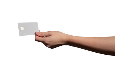 A young woman holding a golden chip credit card with a chip, promoting cashless payment for shopping. The card is in a horizontal position, with sunlight highlighting the details. Closeup, with a gray
