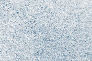 Ice texture crystal, blue tones background. Textured cold frosty surface of ice..
