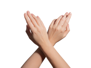 Hand with neatly groomed short nails crossing fingers in an elegant gesture. Glossy, soft skin with a natural manicure. Feminine beauty, hygiene, and skincare. Isolated on white background..