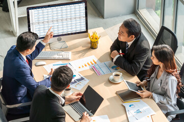 Accounting software on computer screen showing financial statement spreadsheets and account balance...
