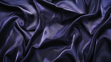 A close-up view of a luxurious deep blue silk fabric, showcasing elegant folds and a smooth texture, ideal for various artistic designs.