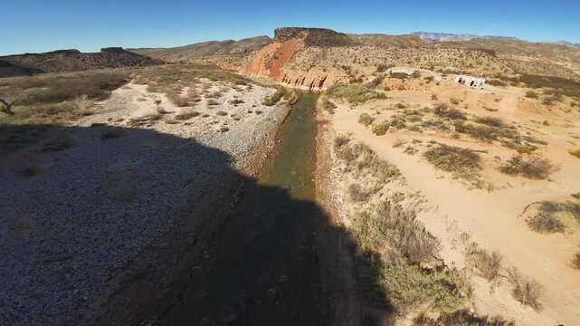 Virgin River Gorge- Hurricane, Utah, USA - February 10, 2025: Aerial-FPV-Diving from high to just over river-Chasing waterfowl