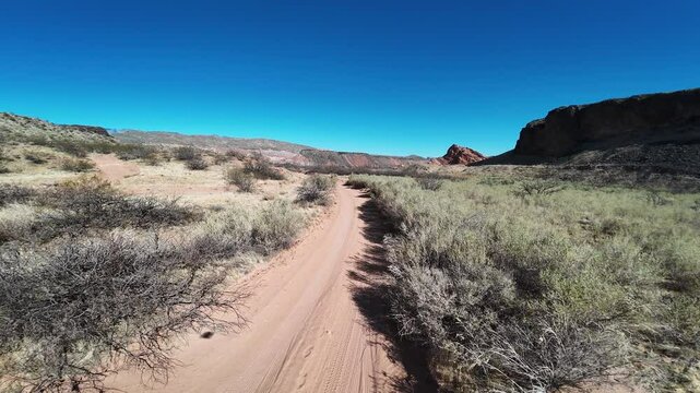 Virgin River Gorge- Hurricane, Utah, USA - February 10, 2025: Aerial-FPV-Flying through Babylon house graffiti covered ruins to Stormont silver mill ruins