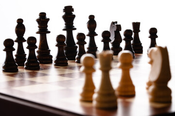 Chess game with wood pieces ready to play