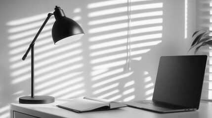 Modern workspace with lamp and open notebook in minimalist design
