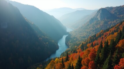 Obraz premium A majestic aerial perspective of a mountain range covered in a dense forest, with a winding river carving its path through the valleys